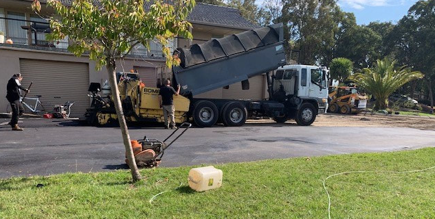 This is a photo of an asphalt driveway which is in the process of being installed by Forbes Road Tek